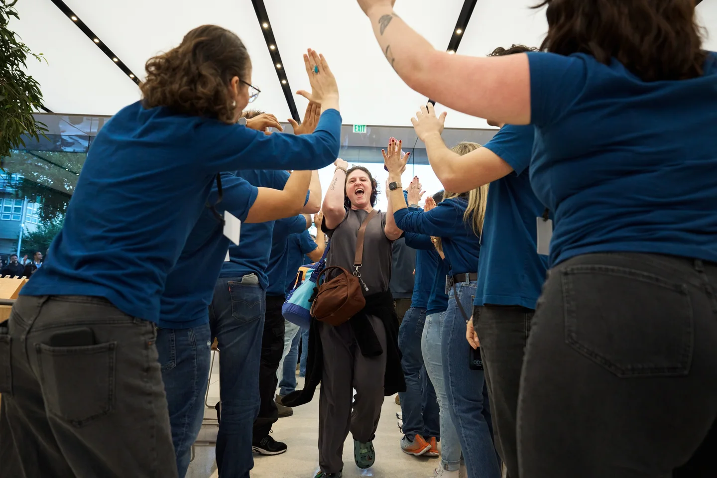 Team members welcome customers to Apple Domain NORTHSIDE for the launch of iPhone Duo.
