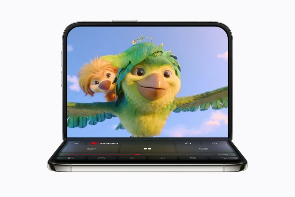 A partially folded iPhone Duo device shows an animated TV show playing in the Netflix app.